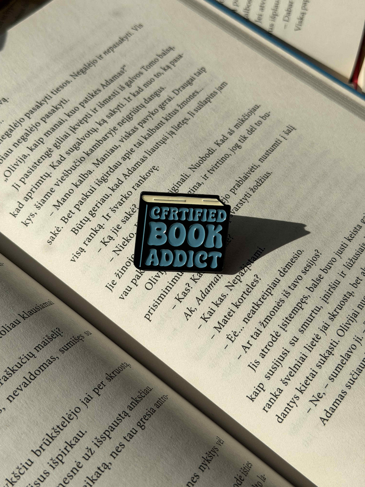 Pins "Certified book addict"