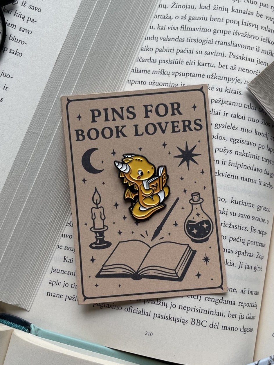 Pins "Dragon reading Fourth Wing"
