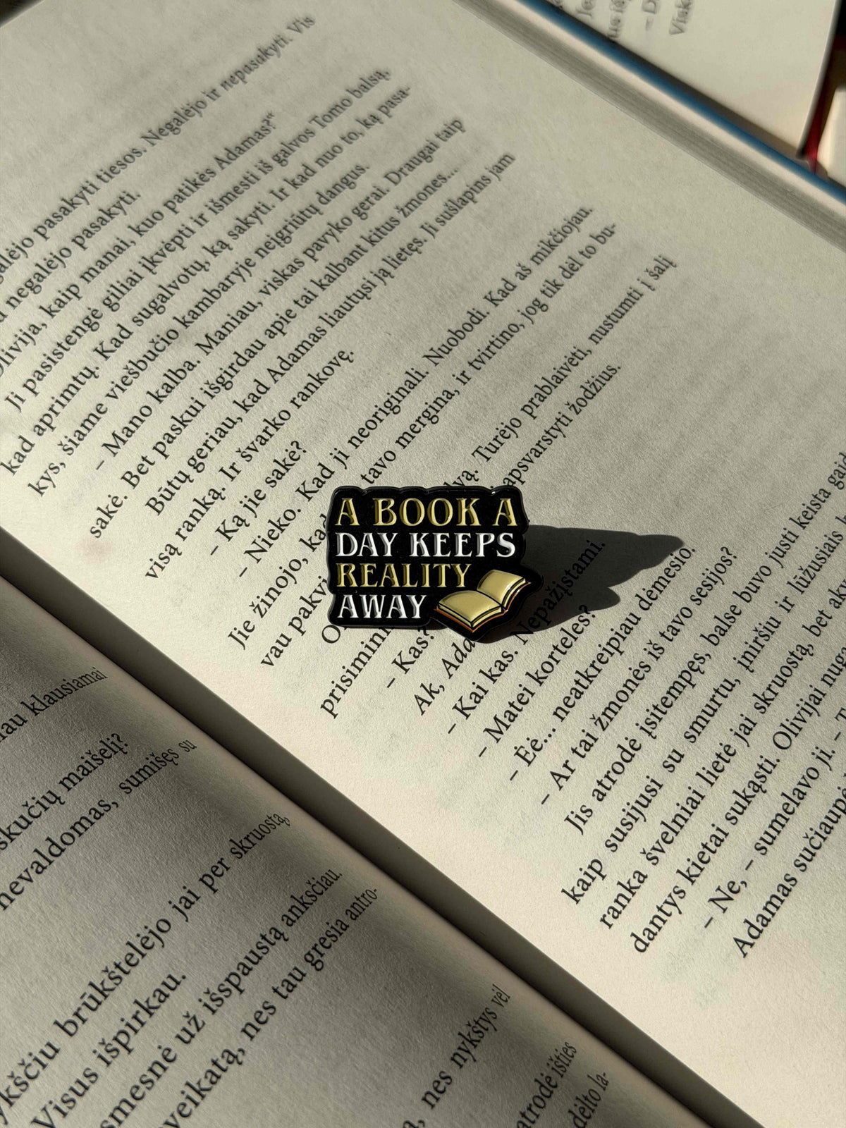 Pins "A book a day keeps reality away"